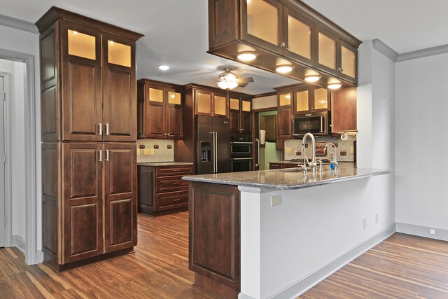 404 S Greenwood Ave, Columbia, MO 65203 - kitchen featuring stainless steel microwave, high end refrigerator, dark wood-type flooring, backsplash, and recessed lighting
