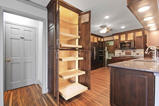 404 S Greenwood Ave, Columbia, MO 65203 - kitchen featuring open shelves, a sink, appliances with stainless steel finishes, dark wood-style flooring, and a ceiling fan