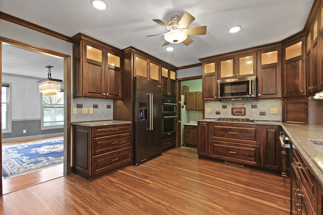 404 S Greenwood Ave, Columbia, MO 65203 - kitchen featuring stainless steel appliances, crown molding, a ceiling fan, dark brown cabinetry, and dark wood-style flooring