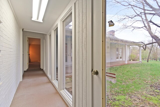 404 S Greenwood Ave, Columbia, MO 65203 - hallway with light carpet, brick wall, and crown molding
