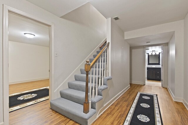404 S Greenwood Ave, Columbia, MO 65203 - stairway featuring wood finished floors and baseboards