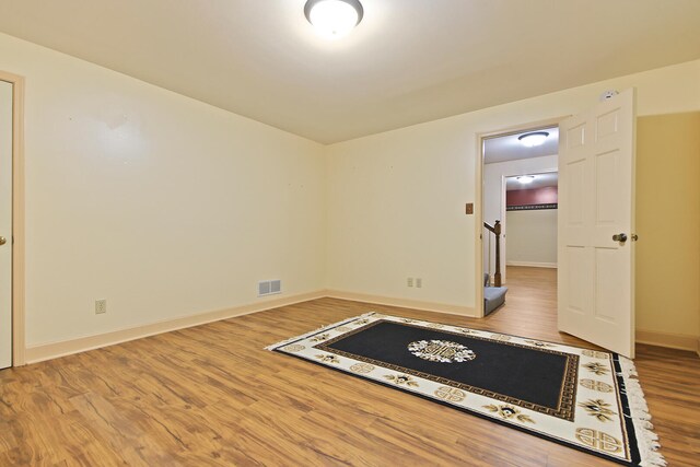404 S Greenwood Ave, Columbia, MO 65203 - unfurnished room featuring wood finished floors and baseboards