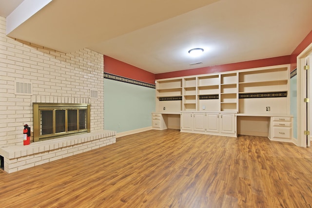 404 S Greenwood Ave, Columbia, MO 65203 - unfurnished living room with wood finished floors and baseboards
