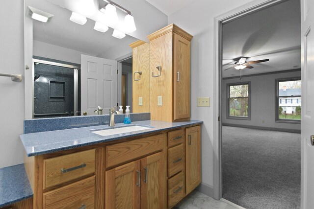 404 S Greenwood Ave, Columbia, MO 65203 - bathroom with vanity, a ceiling fan, a shower stall, marble finish floors, and baseboards