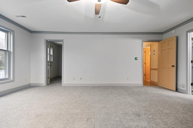 404 S Greenwood Ave, Columbia, MO 65203 - carpeted spare room featuring ceiling fan, crown molding, and baseboards