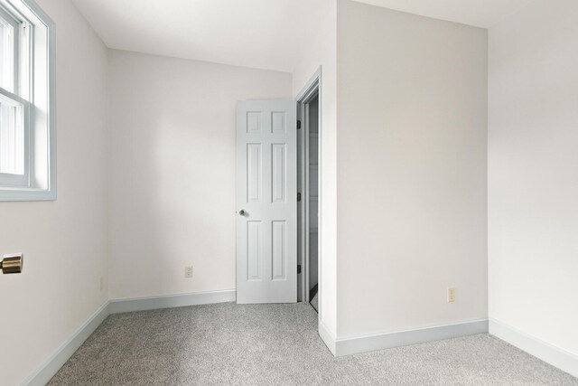 404 S Greenwood Ave, Columbia, MO 65203 - unfurnished room featuring carpet floors and baseboards