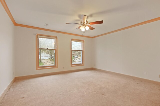 404 S Greenwood Ave, Columbia, MO 65203 - spare room with light colored carpet, ceiling fan, ornamental molding, and baseboards