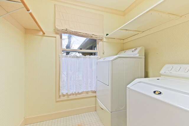 404 S Greenwood Ave, Columbia, MO 65203 - laundry room featuring washing machine and dryer, tile patterned flooring, and baseboards