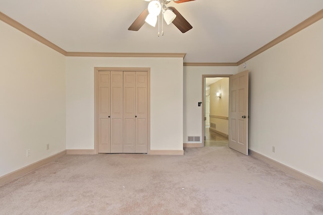 404 S Greenwood Ave, Columbia, MO 65203 - unfurnished bedroom with ornamental molding, light colored carpet, baseboards, a ceiling fan, and a closet