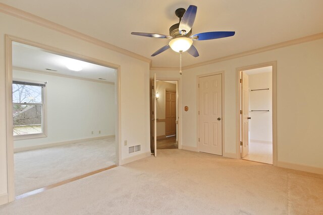 404 S Greenwood Ave, Columbia, MO 65203 - unfurnished bedroom featuring light carpet, ornamental molding, baseboards, and connected bathroom
