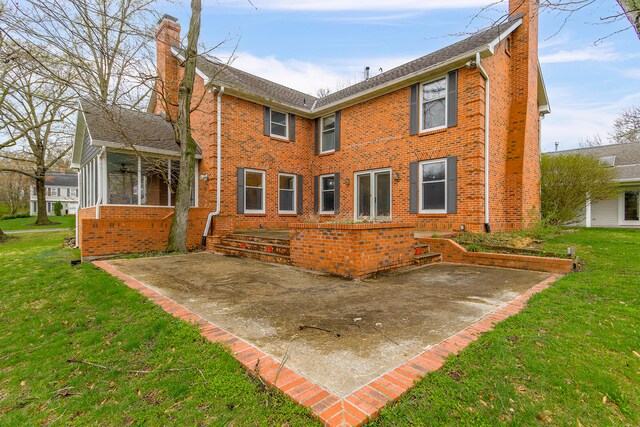 404 S Greenwood Ave, Columbia, MO 65203 - back of house with a chimney, a patio area, and brick siding