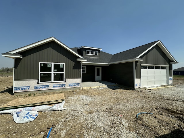 301 W Francis St, Sturgeon, MO 65284 - property in mid-construction with a garage, roof with shingles, and gravel driveway