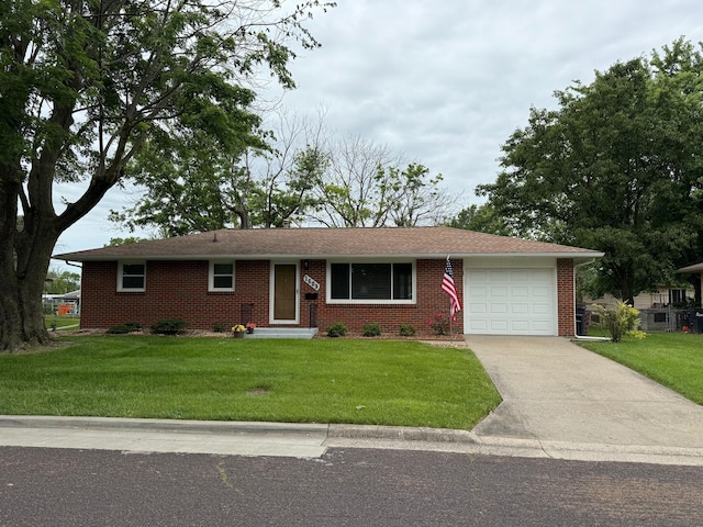 1609 Doris Dr, Columbia, MO 65202 - single story home with a garage, concrete driveway, a front lawn, and brick siding