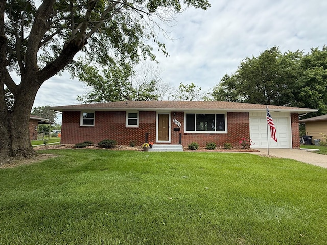 1609 Doris Dr, Columbia, MO 65202 - ranch-style home featuring a garage, concrete driveway, brick siding, and a front lawn
