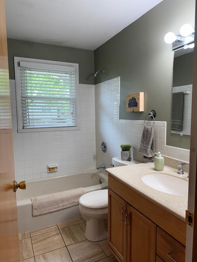 1609 Doris Dr, Columbia, MO 65202 - bathroom with vanity, tub / shower combination, toilet, tile walls, and tile patterned floors