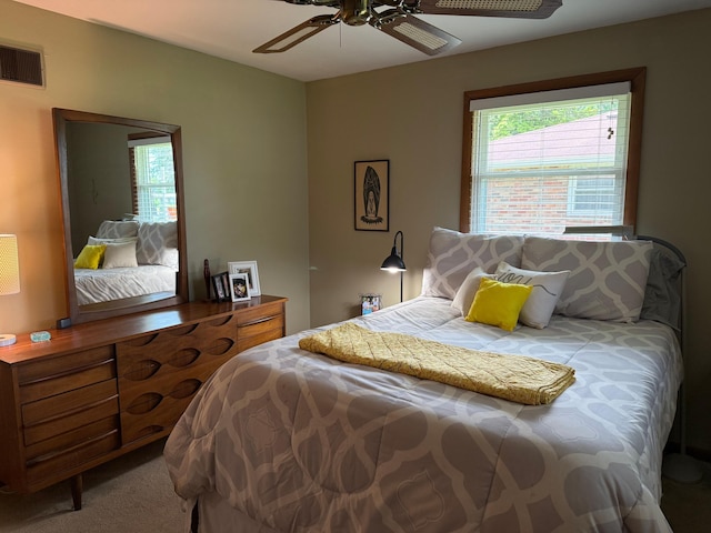 1609 Doris Dr, Columbia, MO 65202 - carpeted bedroom featuring multiple windows and a ceiling fan