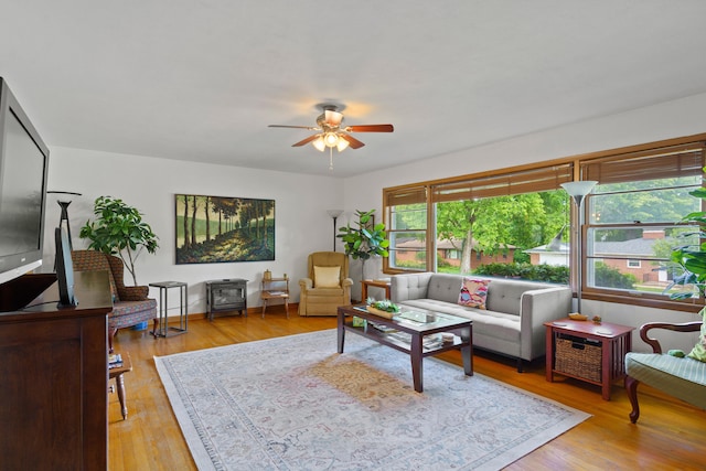 368 Crown Pt, Columbia, MO 65203 - living room featuring a ceiling fan, wood finished floors, and baseboards