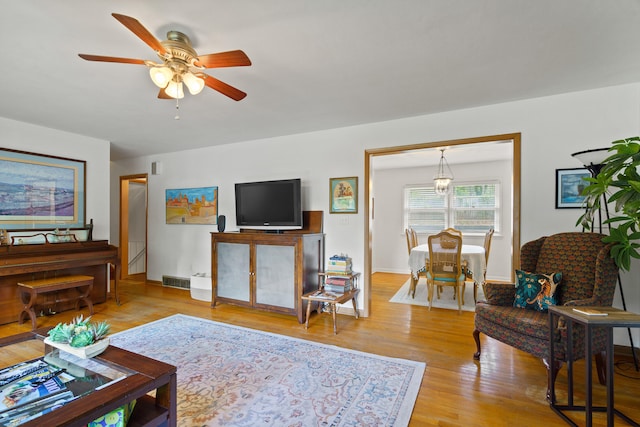 368 Crown Pt, Columbia, MO 65203 - living area featuring ceiling fan, light wood-type flooring, and baseboards