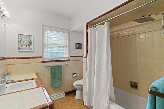 368 Crown Pt, Columbia, MO 65203 - bathroom featuring toilet, a baseboard radiator, tile walls, a wainscoted wall, and shower / bathtub combination with curtain