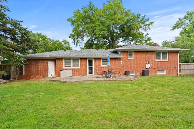 368 Crown Pt, Columbia, MO 65203 - back of property with central air condition unit, a patio area, and brick siding