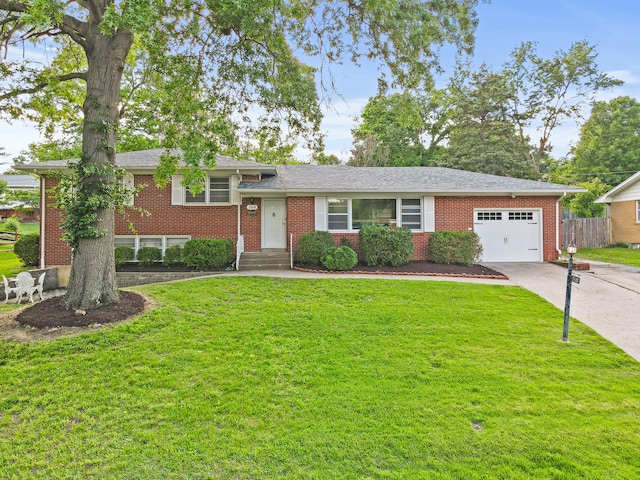 368 Crown Pt, Columbia, MO 65203 - tri-level home featuring a garage, concrete driveway, brick siding, and a shingled roof