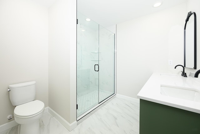 1152 E Bluebird Ln, Columbia, MO 65201 - full bath with marble finish flooring, toilet, double vanity, a marble finish shower, and baseboards