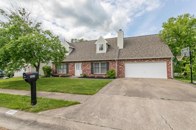 1411 Kinloch Ct, Columbia, MO 65203 - new england style home with brick siding, a shingled roof, a front lawn, and concrete driveway