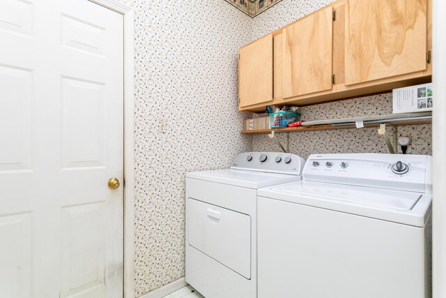 1411 Kinloch Ct, Columbia, MO 65203 - washroom featuring cabinet space and separate washer and dryer