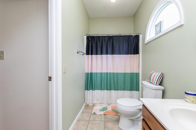 1411 Kinloch Ct, Columbia, MO 65203 - bathroom with vanity, toilet, and baseboards