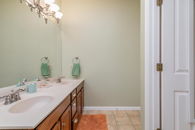 1411 Kinloch Ct, Columbia, MO 65203 - bathroom with double vanity and baseboards