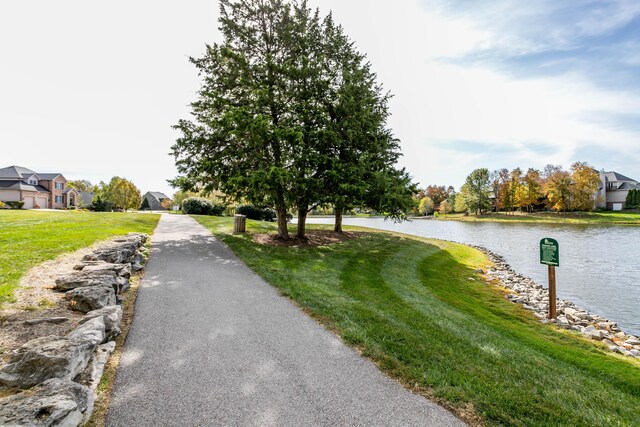 1411 Kinloch Ct, Columbia, MO 65203 - view of asphalt driveway featuring a water view