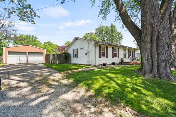 105 W Johnson Ave, Ashland, MO 65010 - view of front of property featuring a garage and an outdoor structure