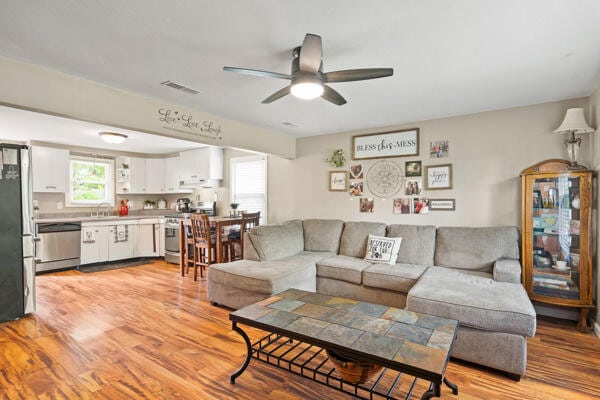 105 W Johnson Ave, Ashland, MO 65010 - living room with a ceiling fan and light wood-style floors