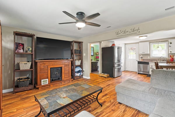 105 W Johnson Ave, Ashland, MO 65010 - living room featuring a ceiling fan and light wood finished floors