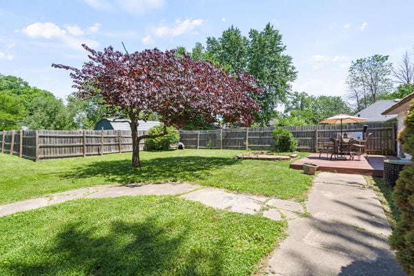 105 W Johnson Ave, Ashland, MO 65010 - view of yard featuring a wooden deck and outdoor dining area