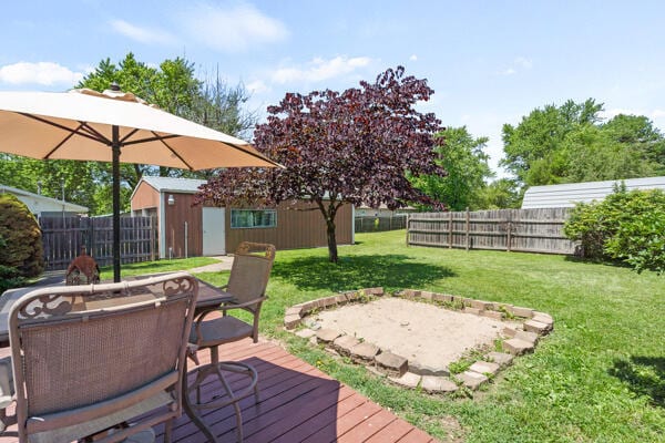 105 W Johnson Ave, Ashland, MO 65010 - deck featuring an outdoor structure, outdoor dining area, and a patio