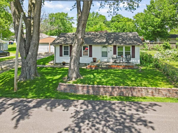 105 W Johnson Ave, Ashland, MO 65010 - ranch-style house with covered porch and a detached garage