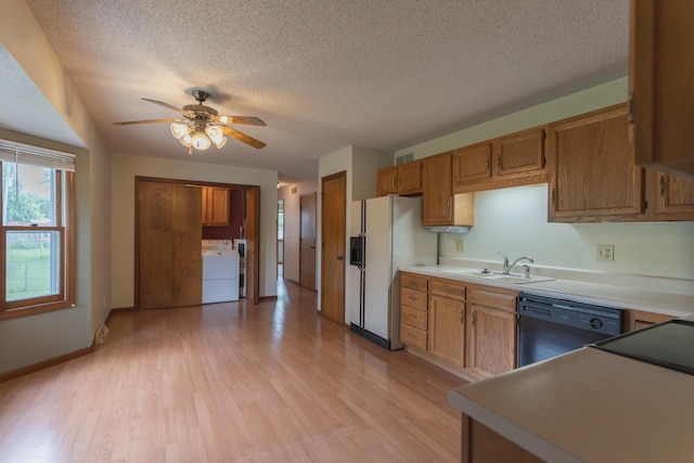 606 Wientz St, Moberly, MO 65270 - kitchen with white fridge with ice dispenser, dishwasher, light wood finished floors, a sink, and ceiling fan
