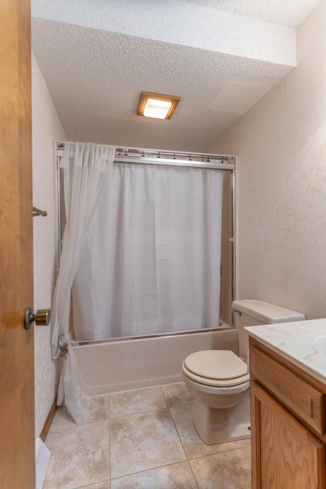 606 Wientz St, Moberly, MO 65270 - full bathroom with shower / bath combination with curtain, vanity, toilet, a textured ceiling, and tile patterned flooring