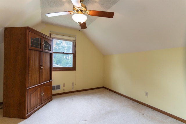 606 Wientz St, Moberly, MO 65270 - bonus room with lofted ceiling, a ceiling fan, light colored carpet, and baseboards