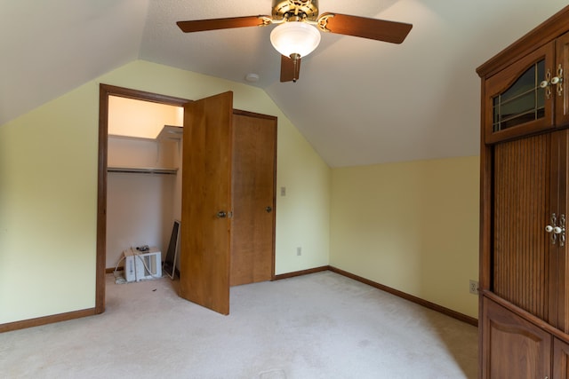 606 Wientz St, Moberly, MO 65270 - unfurnished bedroom with light colored carpet, vaulted ceiling, a closet, ceiling fan, and baseboards
