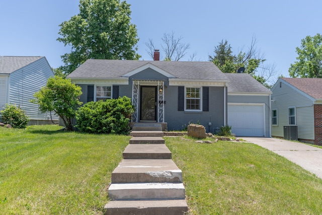 1224 Woody Ave, Moberly, MO 65270 - view of front facade with an attached garage, driveway, a front yard, roof with shingles, and a chimney
