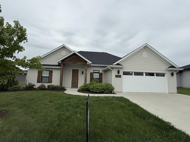 4909 Longbow Dr, Columbia, MO 65201 - view of front of house with an attached garage, driveway, and a front lawn
