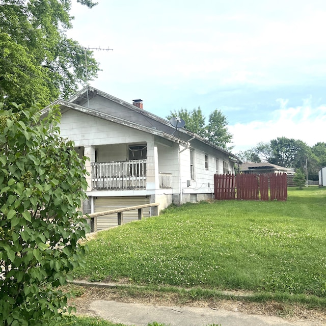 402 E 4th St, Salisbury, MO 65281 - view of home's exterior featuring a chimney and a balcony