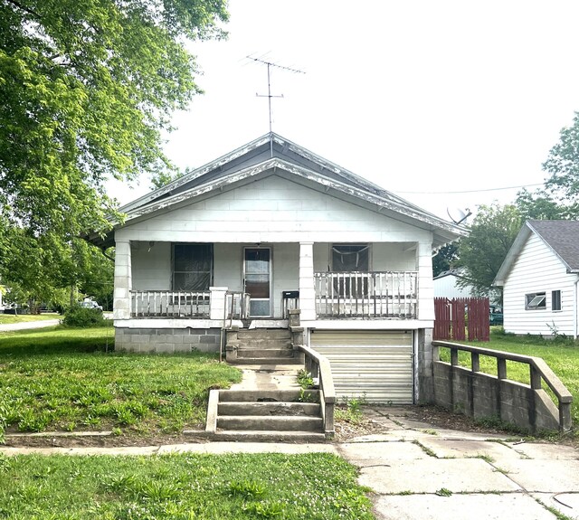 402 E 4th St, Salisbury, MO 65281 - view of front of house with a porch and concrete driveway