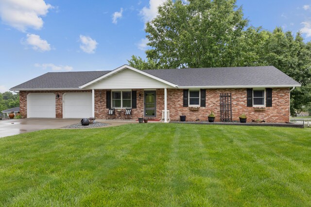 109 N Linnwood Dr, Linn, MO 65051 - ranch-style home with an attached garage, a front lawn, driveway, and brick siding