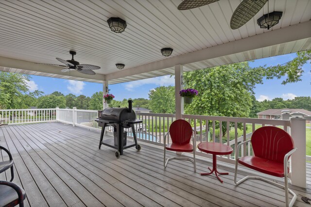 109 N Linnwood Dr, Linn, MO 65051 - deck featuring ceiling fan, grilling area, and view of scattered trees