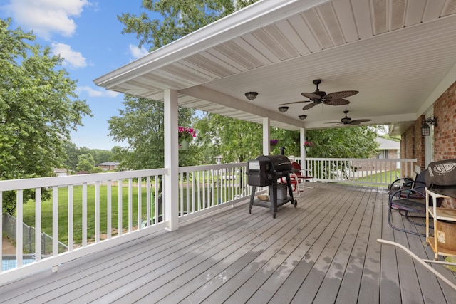 109 N Linnwood Dr, Linn, MO 65051 - deck with a grill, a yard, and ceiling fan