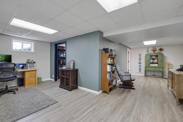 109 N Linnwood Dr, Linn, MO 65051 - office area featuring a paneled ceiling, light wood-style flooring, and baseboards