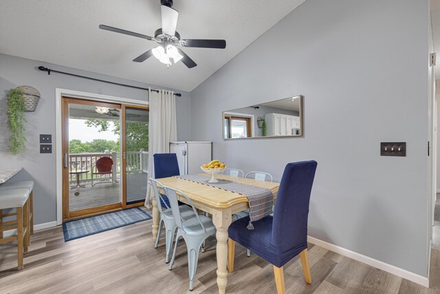 109 N Linnwood Dr, Linn, MO 65051 - dining room featuring lofted ceiling, light wood finished floors, a ceiling fan, baseboards, and healthy amount of natural light